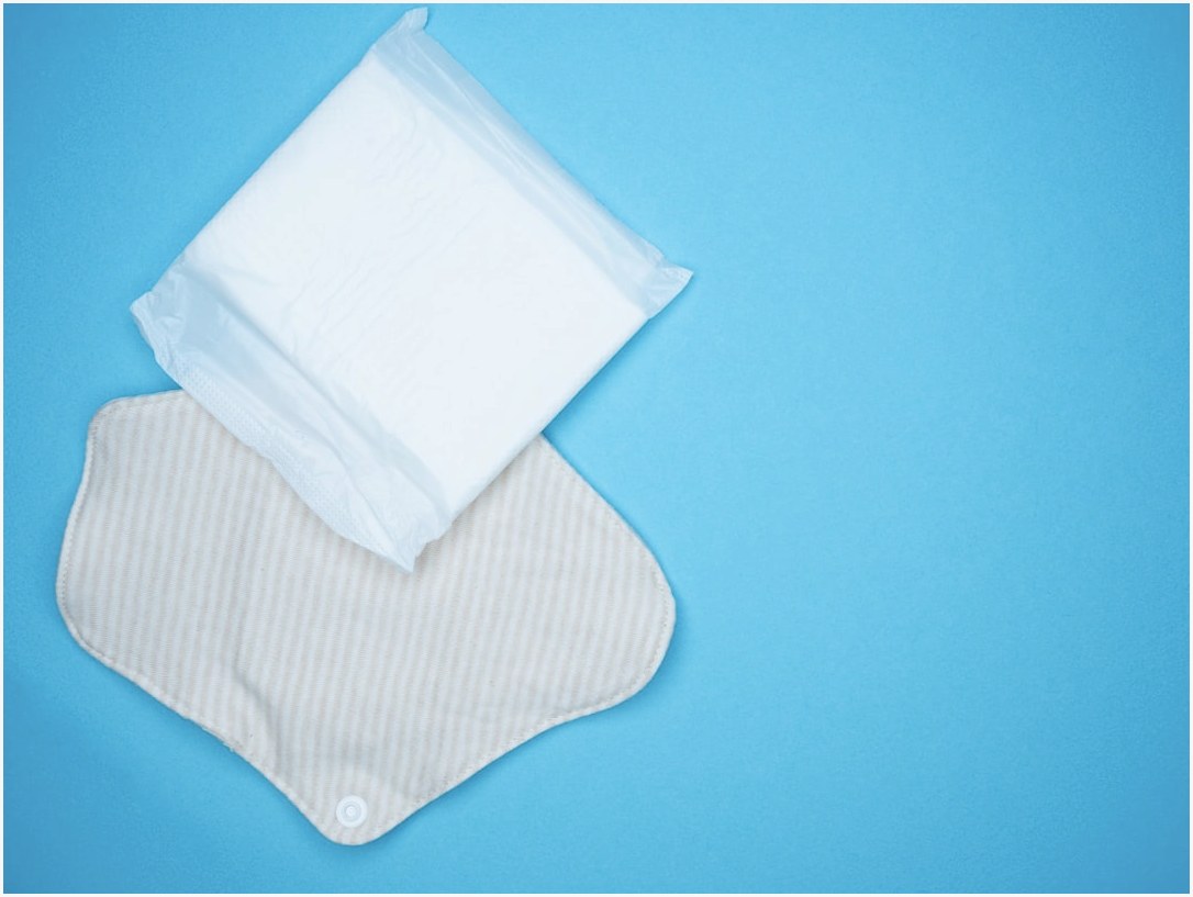 a pair of diapers sitting on top of a blue surface