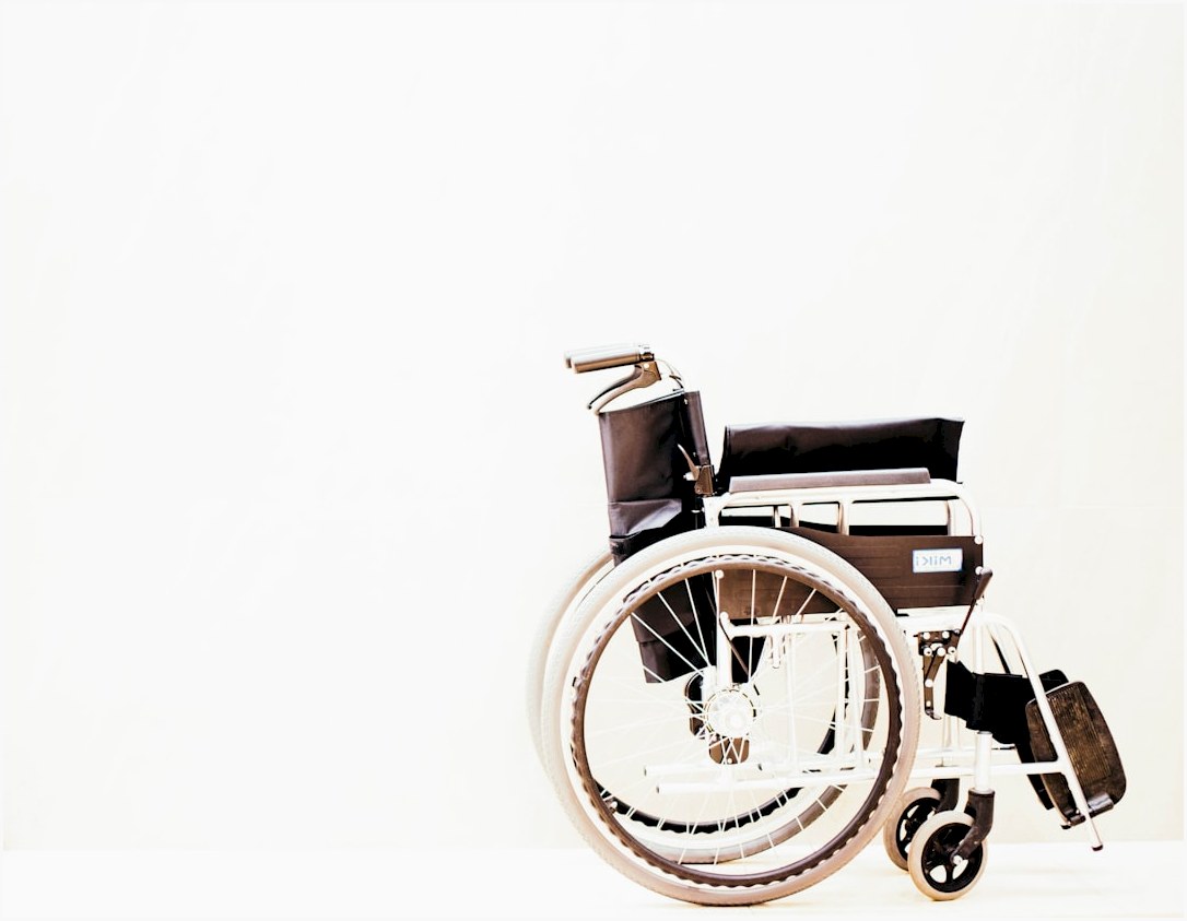 a wheelchair with wheels is shown against a white background