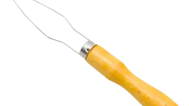Abotoador de camisa com cabo amarelo e ponta metálica